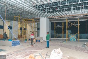 Wide view of the Hazina Trade Centre commercial interior showing ceiling framework and construction scaffolding in Nairobi CBD.